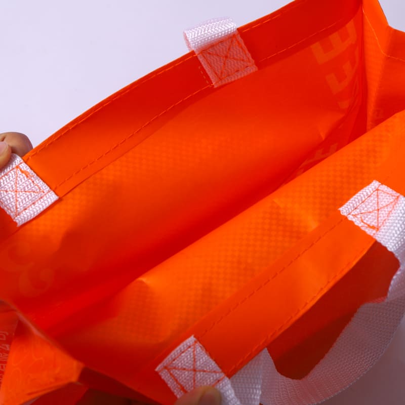 Hand-stitched lines showing manual sewing details on a bag