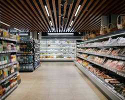 High-volume supermarket shopping bags stacked on shelves