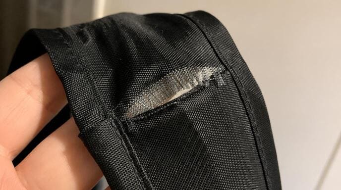 Torn grocery bag handle and failure point